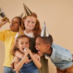 Children Playing with Microphone at Party